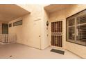 Inviting entrance with decorative door, storage, and warm lighting in a neutral color palette at 19400 N Westbrook Pkwy # 241, Peoria, AZ 85382