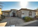 Charming single-story home with a well-maintained front yard, a two-car garage, and attractive desert landscaping at 2145 E Danbury Rd, Phoenix, AZ 85022