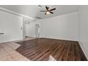 Open living room featuring hard wood floors, white walls, and ceiling fan at 2145 E Danbury Rd, Phoenix, AZ 85022