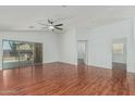 Spacious living room boasting hardwood floors, recessed lighting, and sliding glass doors to the outside at 2444 S Terrell --, Mesa, AZ 85209
