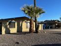 Attractive single-story home with desert landscaping, blue trim, and a large window at 3810 W Belmont Ave, Phoenix, AZ 85051