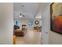 Bright living room with tile flooring, fireplace, and a view of dining area at 4828 E Capistrano Ave, Phoenix, AZ 85044