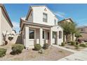 Inviting two-story home with desert landscaping and a covered front porch at 5150 W Illini St, Phoenix, AZ 85043