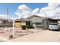 Cozy home with low-maintenance desert landscaping and covered parking at 614 S 92Nd Pl, Mesa, AZ 85208
