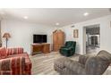 Spacious living room featuring wood-look floors and plenty of natural light at 6615 N 44Th Ave, Glendale, AZ 85301
