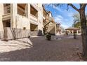 Condo exterior featuring mature tree and garden area with outdoor gazebo and plenty of space at 10136 E Southern Ave # 1114, Mesa, AZ 85209