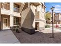 Condo exterior showcasing landscaped yard with a stairway leading to the upper floors of the units at 10136 E Southern Ave # 1114, Mesa, AZ 85209