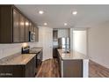 Stylish kitchen showcasing granite counters, stainless steel appliances, and a functional center island at 1082 W 20Th St, Florence, AZ 85132