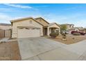 Inviting single-level home boasts a spacious driveway, two-car garage, and convenient front entrance at 1358 E Angie St, Casa Grande, AZ 85122