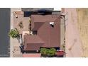 Overhead shot of home showcasing roof, landscaping, fenced yard, and surrounding neighborhood at 1435 Leisure World --, Mesa, AZ 85206