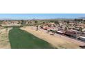 Scenic view of community adjacent to lush golf course with mountain views in the distance at 1435 Leisure World --, Mesa, AZ 85206