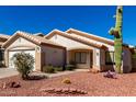 Charming single-story home with desert landscaping and spacious driveway at 2120 E Daley Ln, Phoenix, AZ 85024