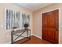 Inviting entryway features a stylish console table and elegant wood flooring at 2318 E Flower St, Phoenix, AZ 85016