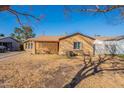 Quaint home featuring well-maintained landscaping and a lattice-covered porch at 2318 E Flower St, Phoenix, AZ 85016