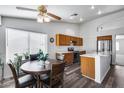 Bright kitchen with stainless steel appliances, a breakfast bar, and a cozy eat-in area at 3702 W Megan St, Chandler, AZ 85226