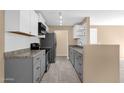 Open kitchen featuring stainless steel appliances, light countertops, and sleek cabinetry at 623 W Guadalupe Rd # 131, Mesa, AZ 85210