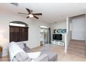 Bright living room with neutral tones, tiled flooring, and sliding door to the backyard at 1350 S Greenfield Rd # 1016, Mesa, AZ 85206