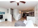 Inviting living room featuring an open floor plan and staircase to the second floor at 1350 S Greenfield Rd # 1016, Mesa, AZ 85206