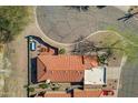 Aerial perspective reveals a private pool, patio area, and terracotta-tiled roof of the charming home at 17360 E Quail Ridge Dr, Fountain Hills, AZ 85268