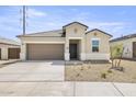 Charming single-story home with a two-car garage and low maintenance desert landscaping at 23997 W Cocopah St, Buckeye, AZ 85326
