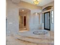 Elegant foyer with marble floors, decorative inlays, archways, and high ceilings at 29423 N 145Th Pl, Scottsdale, AZ 85262