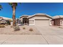 Inviting single-story home with neutral tones and low-maintenance desert landscaping at 4102 E Cathedral Rock Dr, Phoenix, AZ 85044