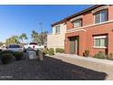 Townhome with a gravel front yard, a tidy landscape and a private entryway at 7726 E Baseline Rd # 207, Mesa, AZ 85209