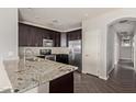 Kitchen with stainless appliances, granite countertops and a stainless steel sink at 7726 E Baseline Rd # 207, Mesa, AZ 85209