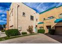 Beige stucco two story condo with well-maintained front yard and garden at 1015 S Val Vista Dr # 81, Mesa, AZ 85204