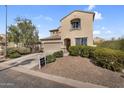 Charming two-story home featuring a two-car garage, neutral stucco exterior, and low maintenance desert landscaping at 1236 E Mescal St, Phoenix, AZ 85020