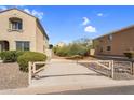 Gated driveway that provides privacy between neighboring homes at 1236 E Mescal St, Phoenix, AZ 85020