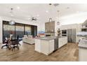 Spacious open concept home with kitchen island and comfortable living area with fireplace at 14715 N Adero Canyon Dr, Fountain Hills, AZ 85268