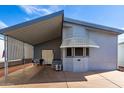 Charming single-story home with covered carport and awning over the front windows at 17200 W Bell Rd # 1628, Surprise, AZ 85374