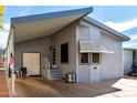 Charming single-story home with covered parking and well-maintained landscaping at 17200 W Bell Rd # 1628, Surprise, AZ 85374