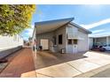 Charming single-story home with covered parking and well-maintained landscaping at 17200 W Bell Rd # 1628, Surprise, AZ 85374