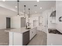 Spacious, eat-in kitchen with an island, modern appliances, and ample counter space at 20570 S 216Th Pl, Queen Creek, AZ 85142