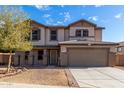 Charming two-story home with a well-manicured front yard and neutral-toned facade at 25589 W Pleasant Ln, Buckeye, AZ 85326