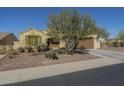 Attractive single-story house with desert landscaping, a spacious driveway, and a two-car garage at 25742 N 103Rd Dr, Peoria, AZ 85383