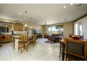 Bright living room featuring tile flooring, an island, and a beautiful living area with leather furniture and a great view at 2662 S Springwood S Blvd # 338, Mesa, AZ 85209