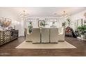 Bright dining room featuring contemporary lighting, neutral color palette and stylish decor at 2744 E Donato Dr, Gilbert, AZ 85298