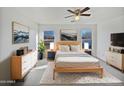 Comfortable bedroom featuring a cozy bed, soft lighting, and coordinated decor at 40995 W Portis Dr, Maricopa, AZ 85138