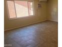 Bright room with window and tiled floors at 4124 E Apollo Rd, Phoenix, AZ 85042