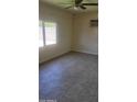 Cozy bedroom with large window and tiled floors at 4124 E Apollo Rd, Phoenix, AZ 85042