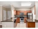 Well-equipped kitchen boasts stainless steel appliances, granite countertops, and tile flooring at 5345 E Van Buren St # 308, Phoenix, AZ 85008