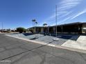Charming manufactured home with rock landscaping and covered front porch at 8269 E Desert Trl, Mesa, AZ 85208