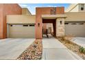 Stylish home exterior featuring unique architecture, desert landscaping, and a welcoming entryway at 11673 N 136Th St # 1019, Scottsdale, AZ 85259