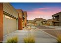 Inviting street view showcases modern home exteriors with desert landscaping and scenic mountain backdrop at 11673 N 136Th St # 1019, Scottsdale, AZ 85259