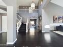 Spacious foyer featuring hardwood floors, high ceilings, a staircase, and an open view of the home's interior at 12403 W Monte Vista Rd Rd, Avondale, AZ 85392