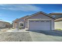 Charming single-story home featuring a two-car garage and low-maintenance desert landscaping at 12621 W Aster Dr, El Mirage, AZ 85335