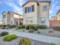 Beautiful home with a well-maintained yard, showcasing its charming facade in a friendly neighborhood at 14247 W Bronco Trl, Surprise, AZ 85387